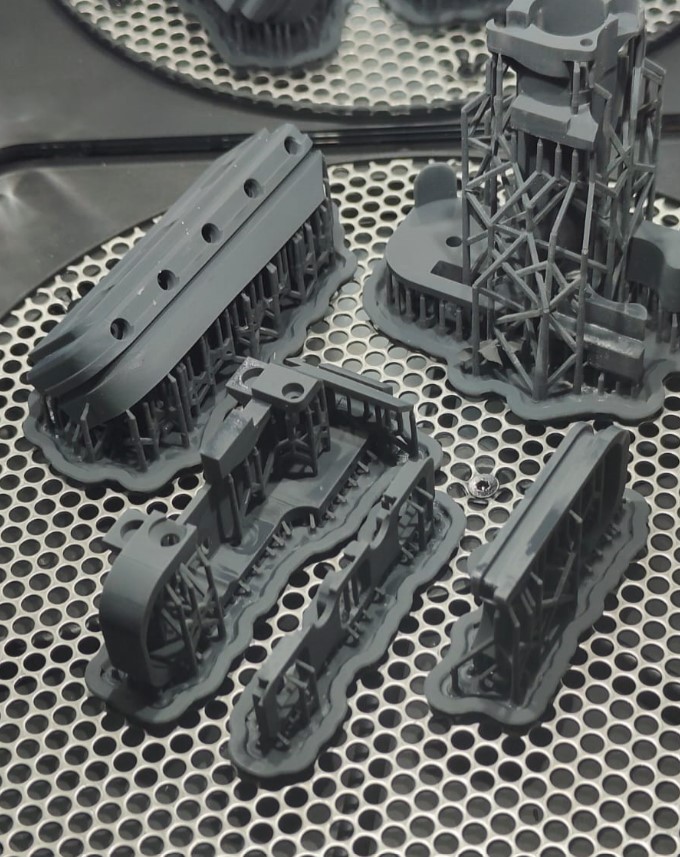 SLA resin parts fresh off the printer with supports